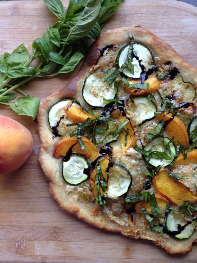 Peach, zucchini, and basil pizza