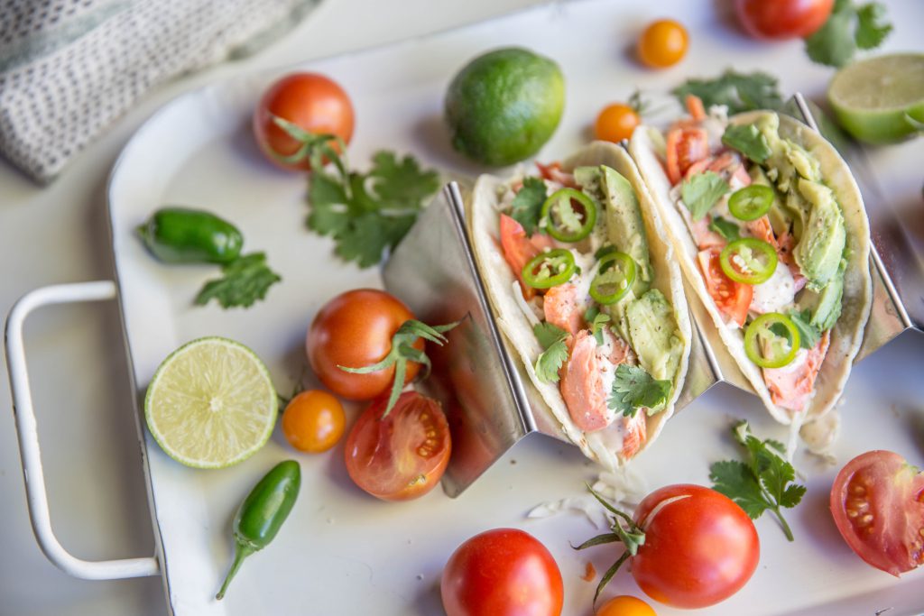 Tray with two chili lime salmon tacos 