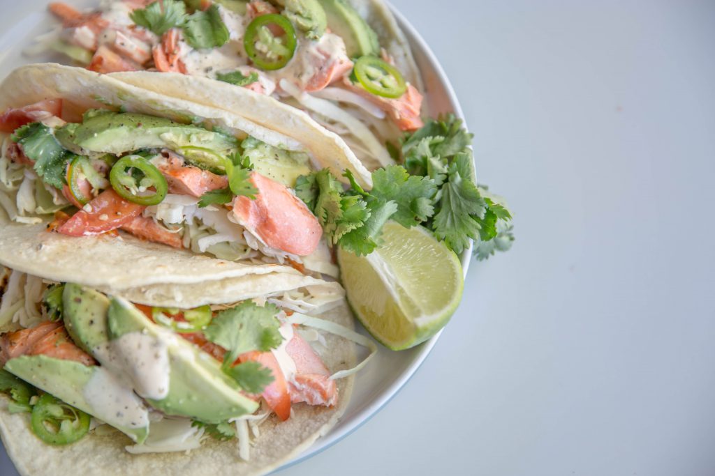 Overhead shot of plate of chili lime salmon tacos